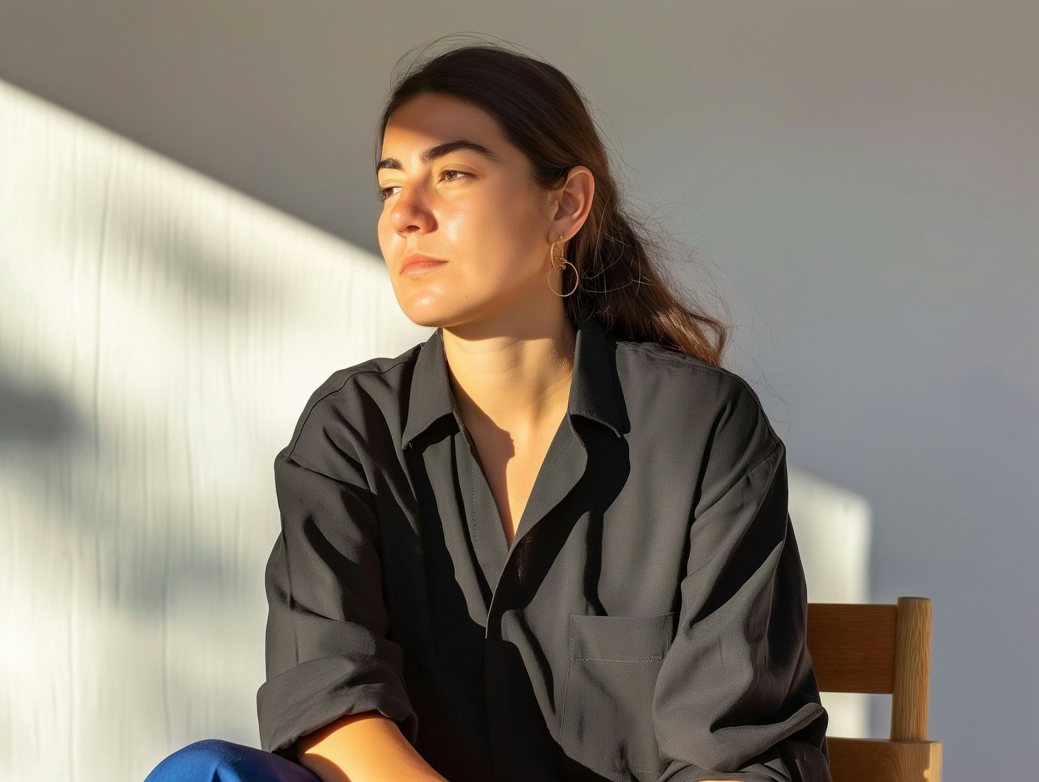 Contemplative Woman in Striped Sunlight
