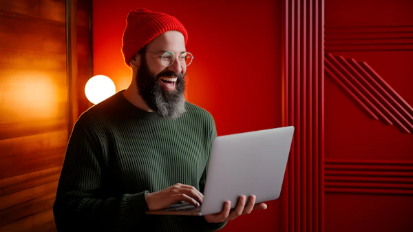 Cheerful Man with Laptop