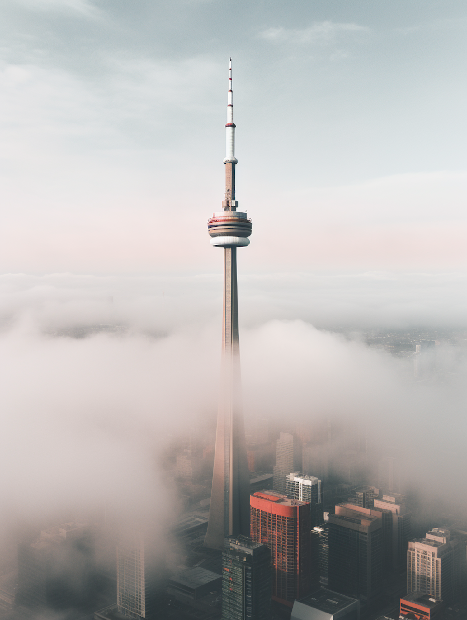 Sky-Piercing Tower Amidst Morning Mist