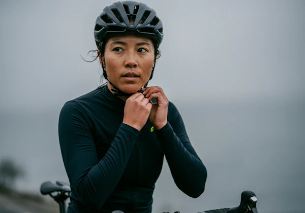 Cyclist Adjusting Helmet