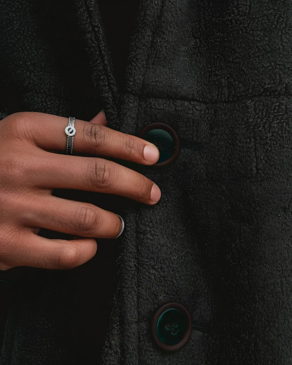Hand on Textured Coat