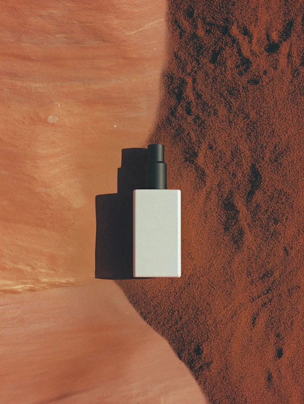 Minimalist Bottle on Earthy Background