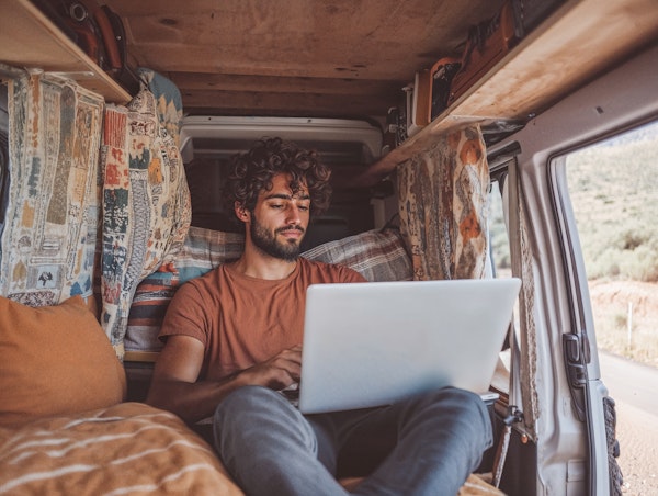 Man Working in Cozy Van