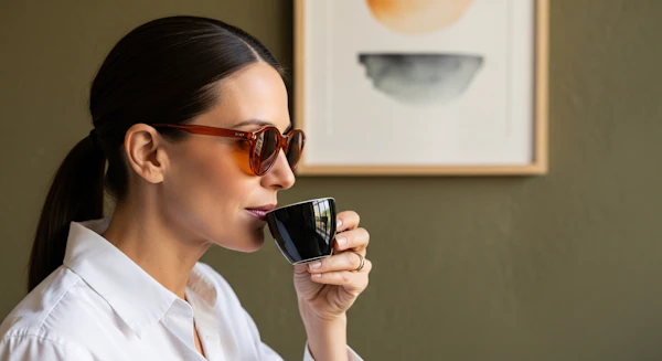 Woman Sipping Coffee