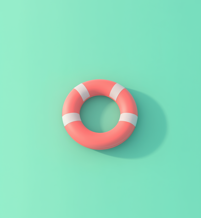 Pink and White Lifebuoy on Teal Background