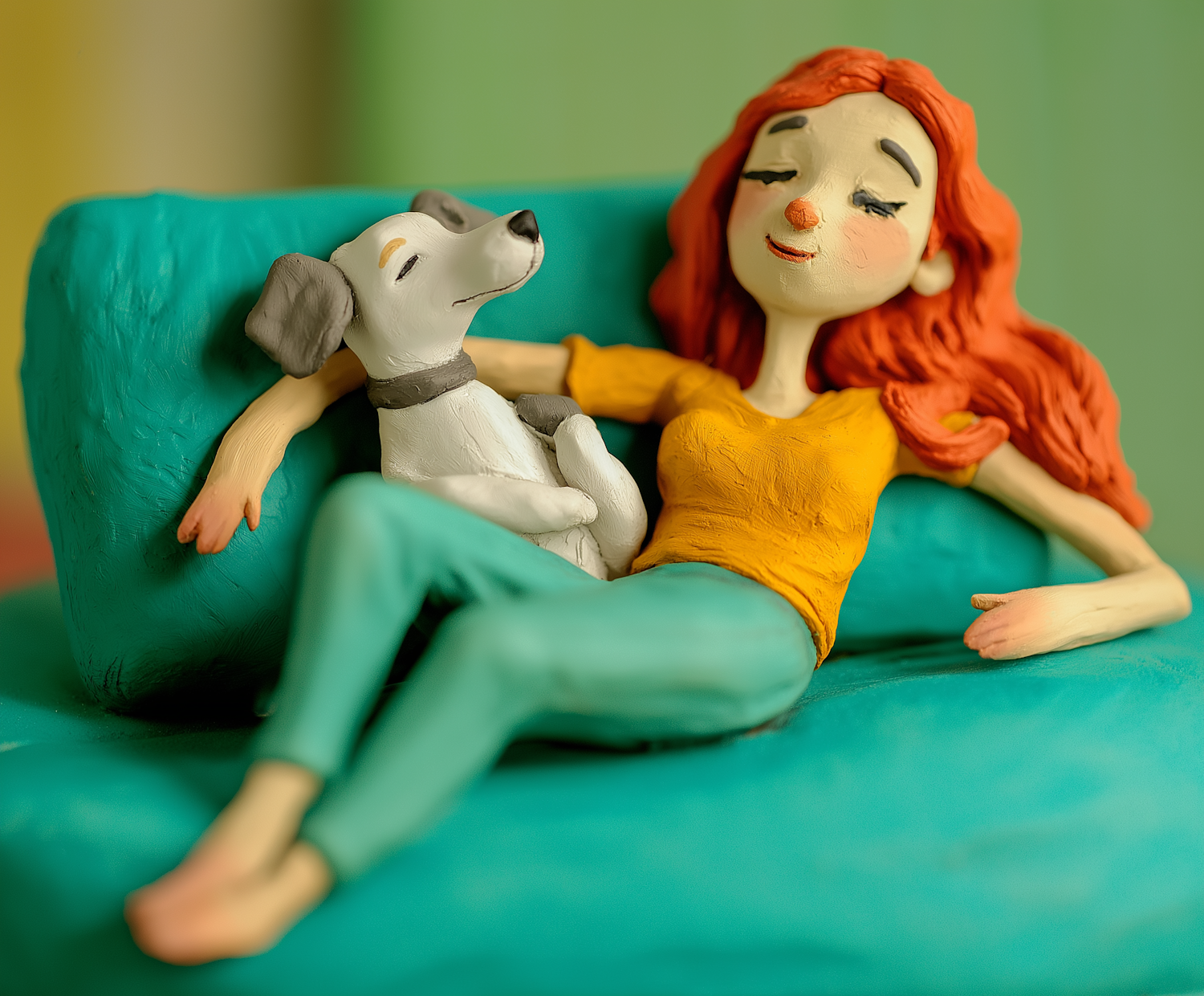 Clay Model of Woman and Dog on Sofa