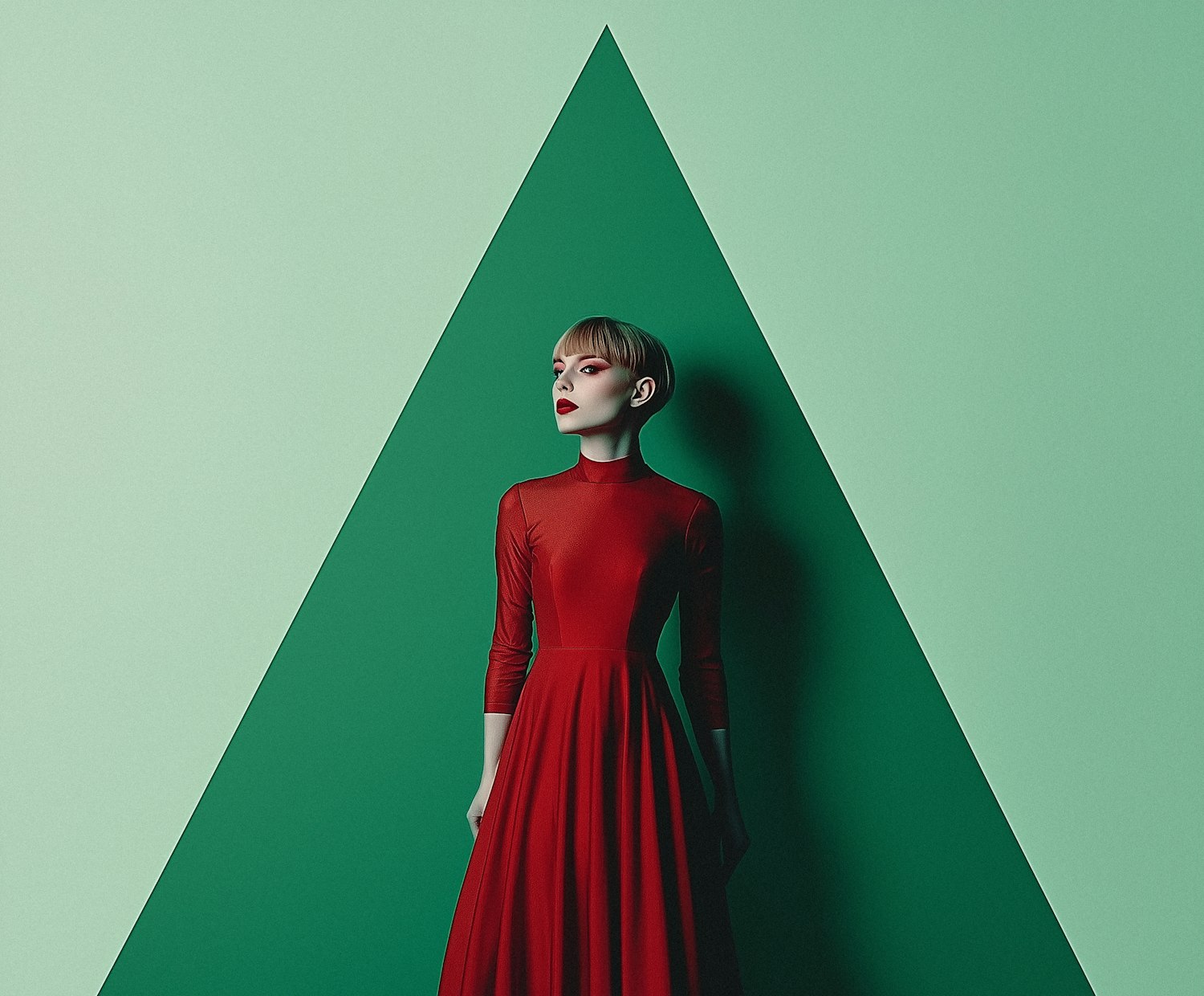 Woman in Red Dress Against Geometric Green Background