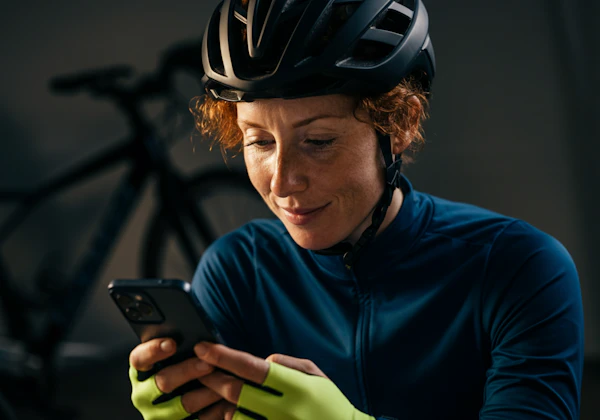 Cyclist Checking Phone