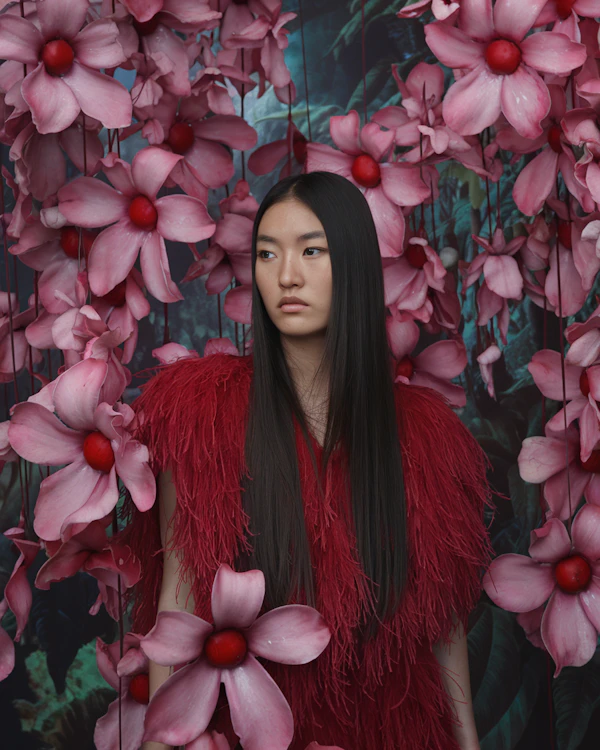 Woman in Red with Floral Backdrop