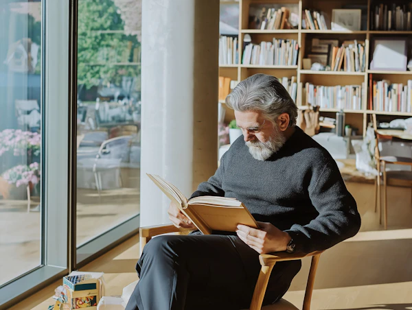 Man Reading by the Window