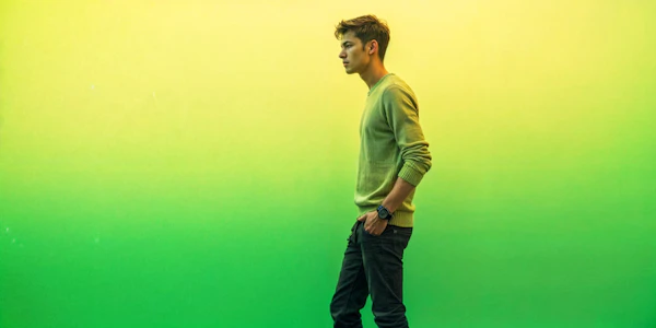 Contemplative Young Man Against Gradient Background