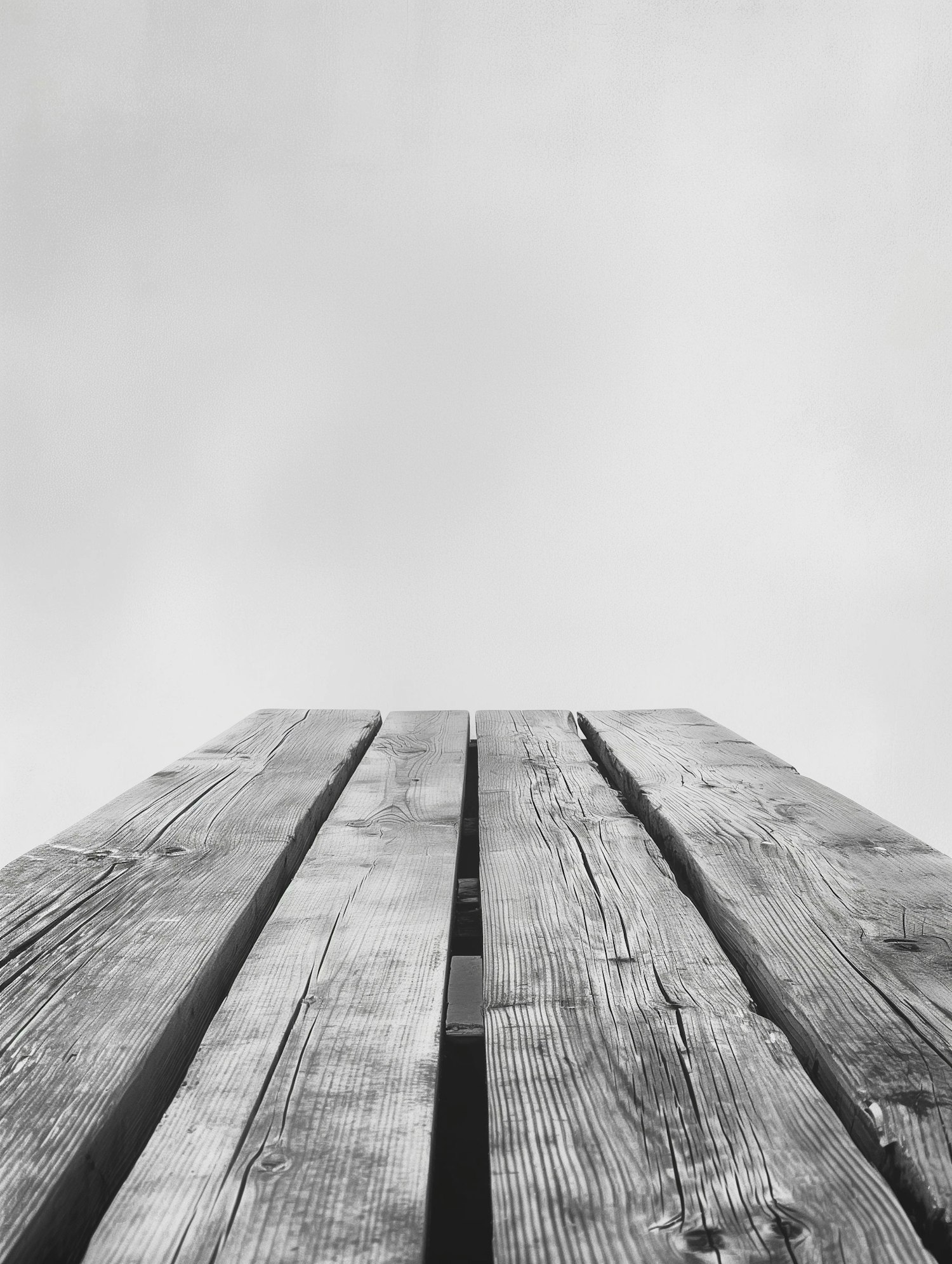 Monochrome Wooden Structure Against Overcast Sky