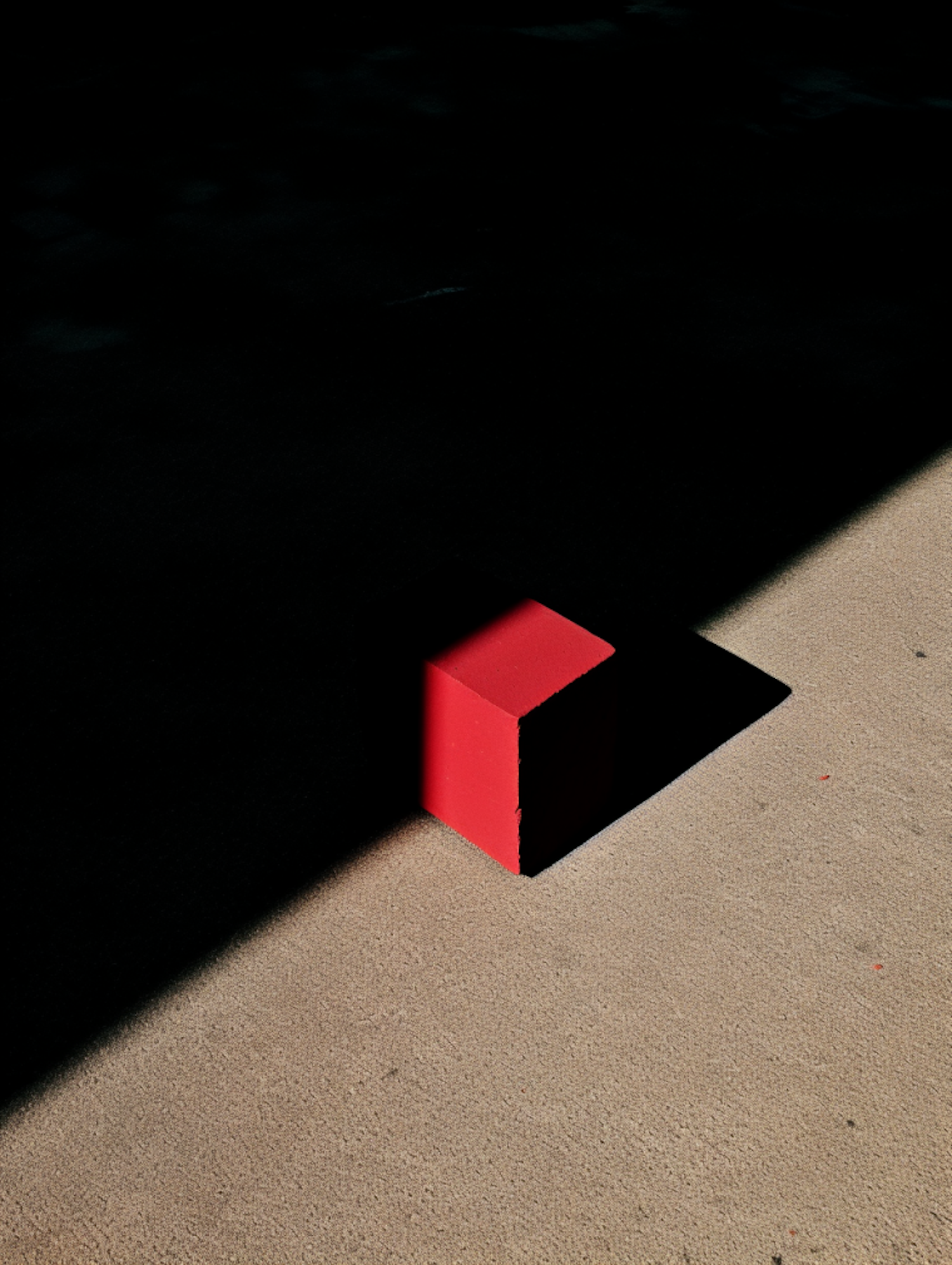 Solitary Crimson Cube in Suspense