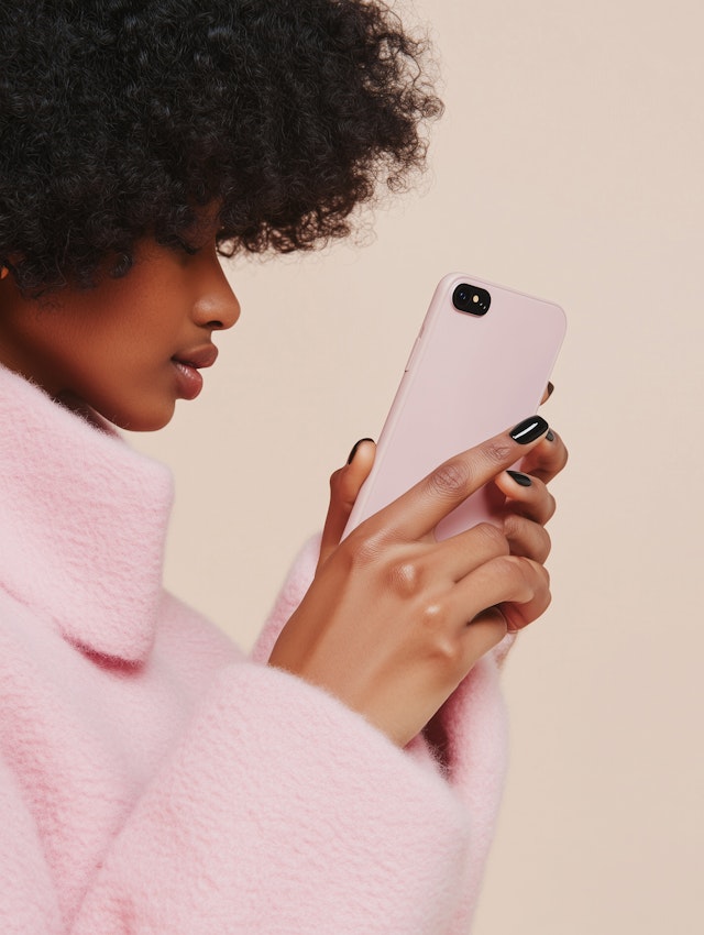 Person with Pink Coat and Smartphone