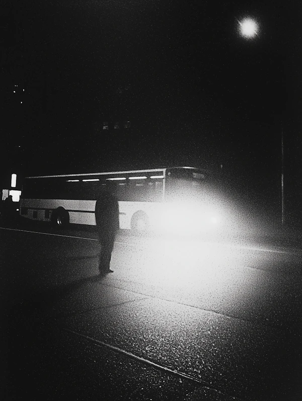 Silhouetted Figure in Nighttime Street