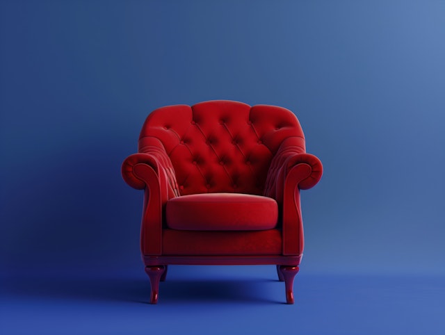 Red Armchair Against Blue Background