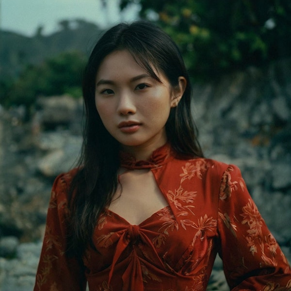 Portrait of a Woman in a Red Floral Dress