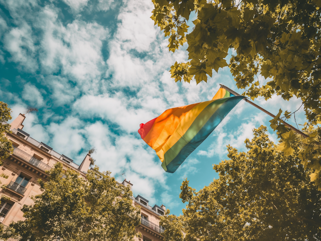 Pride Flag Against Blue Sky