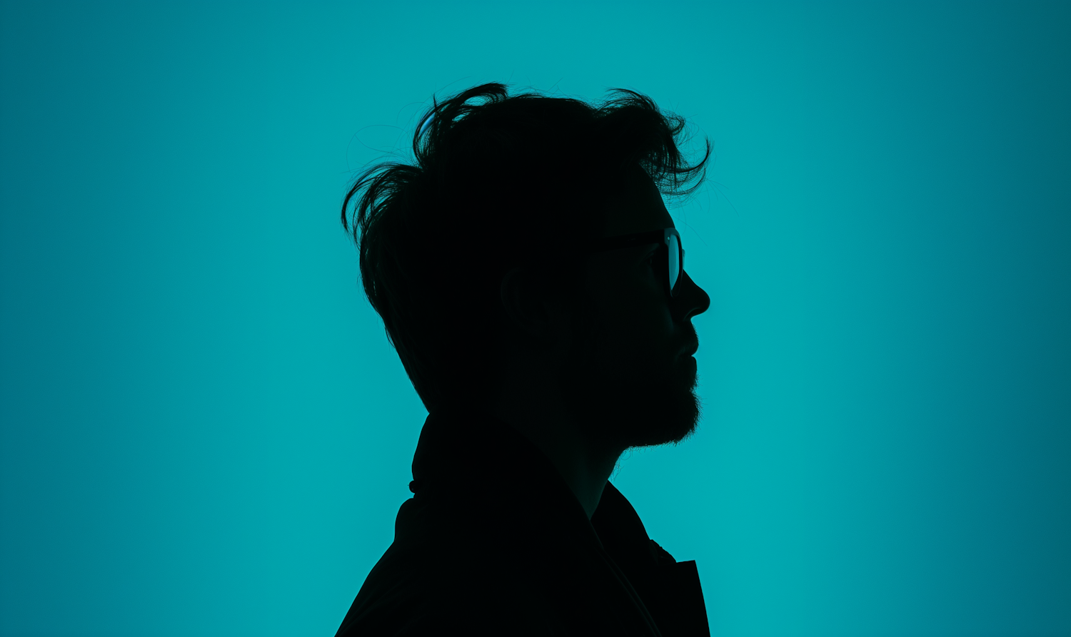 Contemplative Silhouette with Teal Background