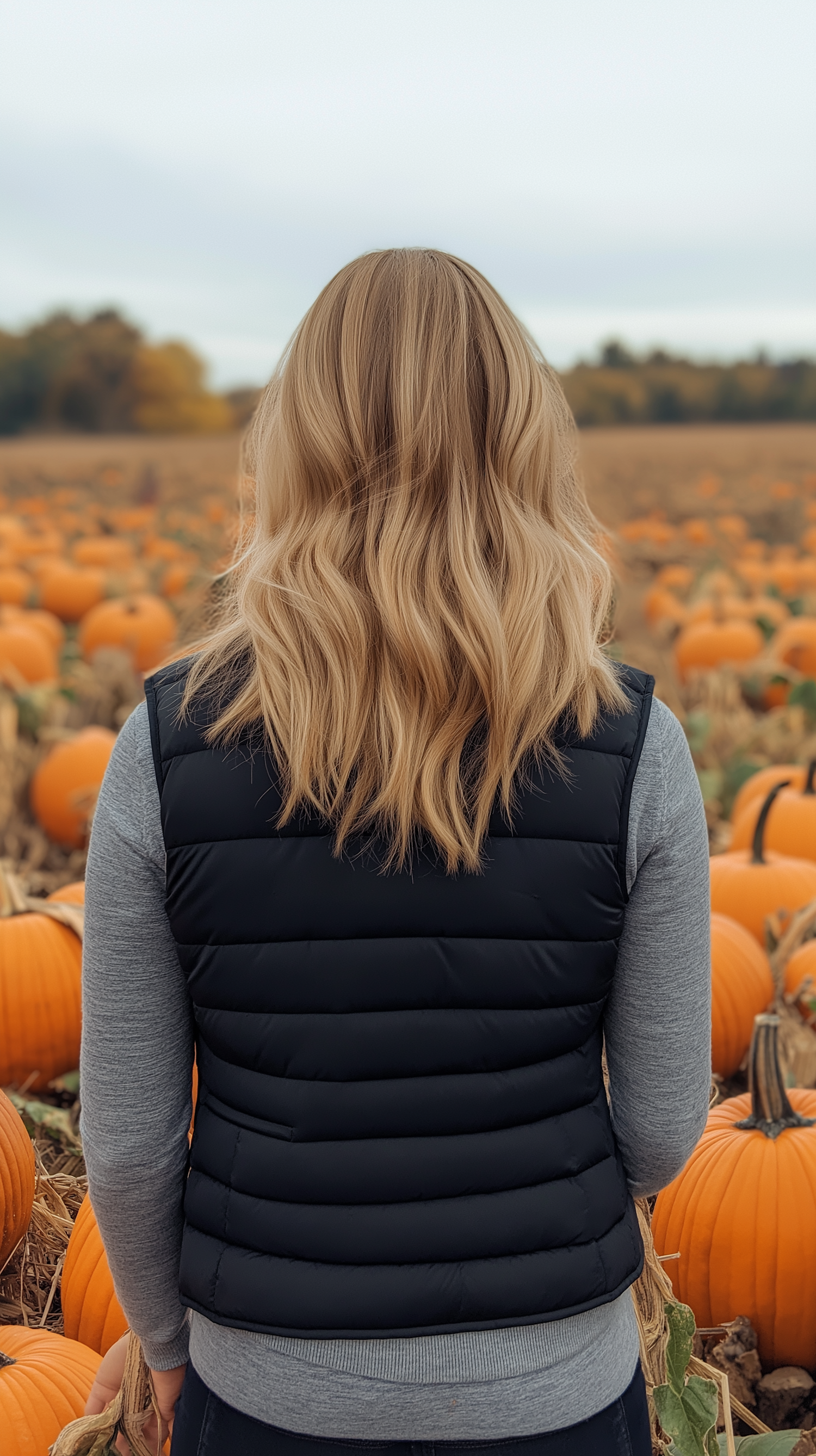 Person in Pumpkin Patch