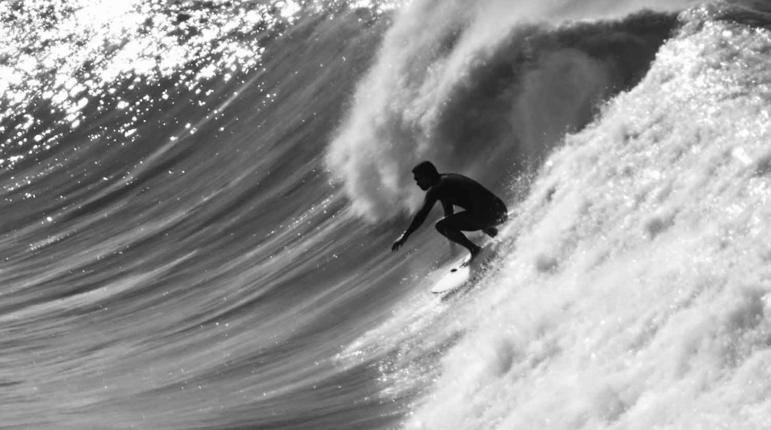 Surfer on a Massive Wave