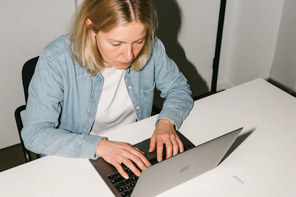 Person Typing at Desk