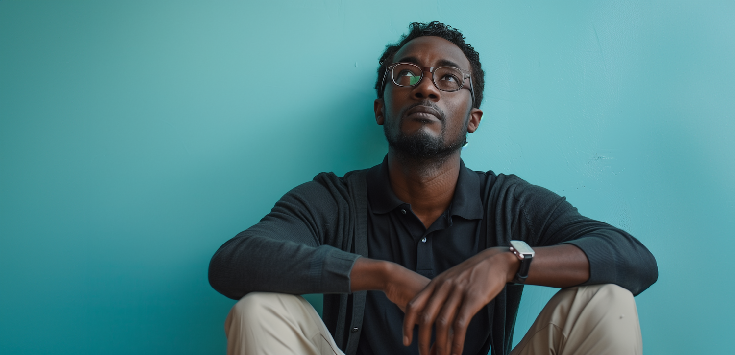 Contemplative Man with Glasses