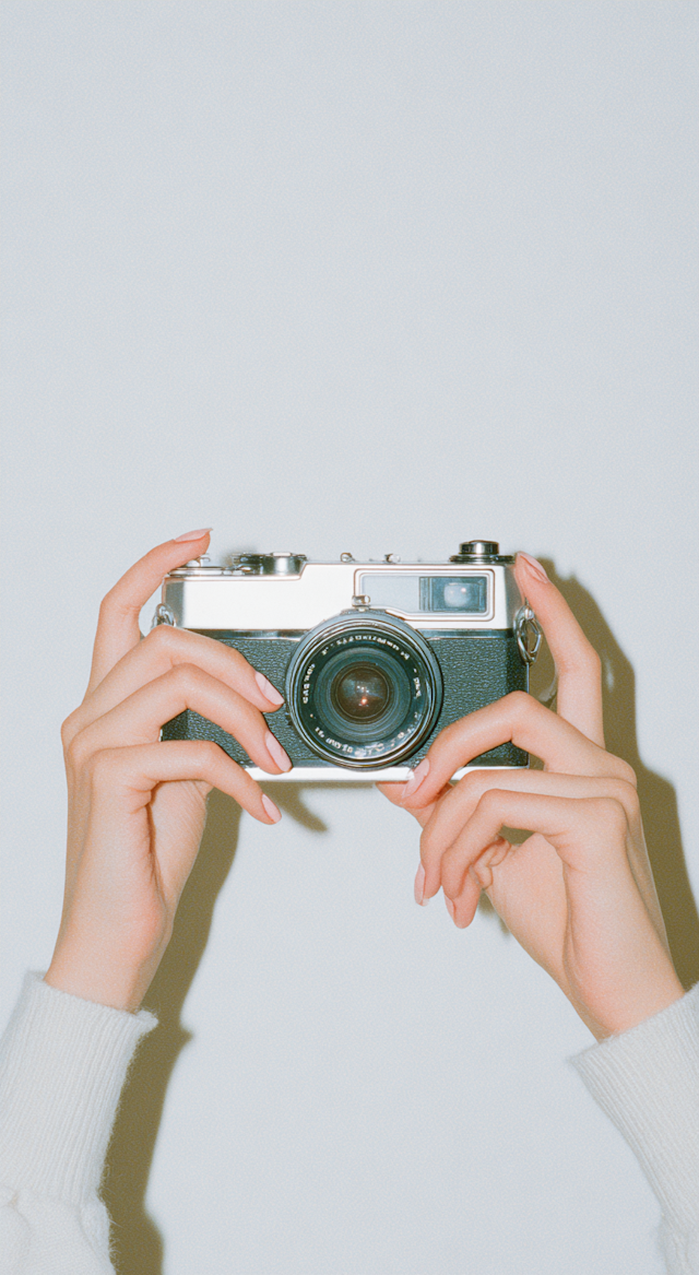 Hands Holding Camera