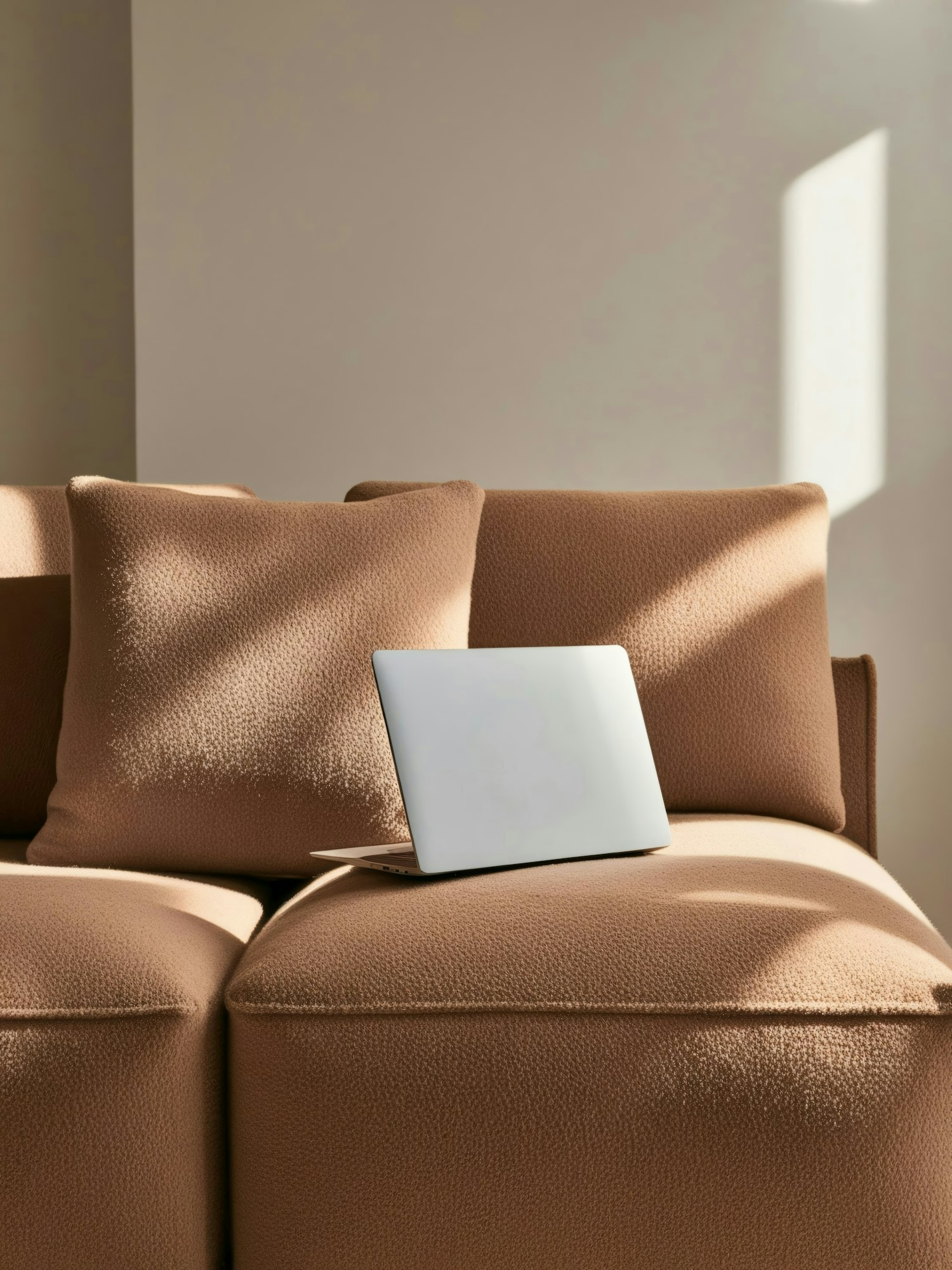 Minimalist Beige Sofa with Laptop