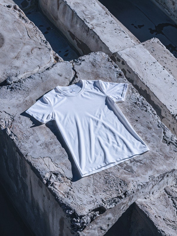 White T-shirt Mockup on Textured Concrete