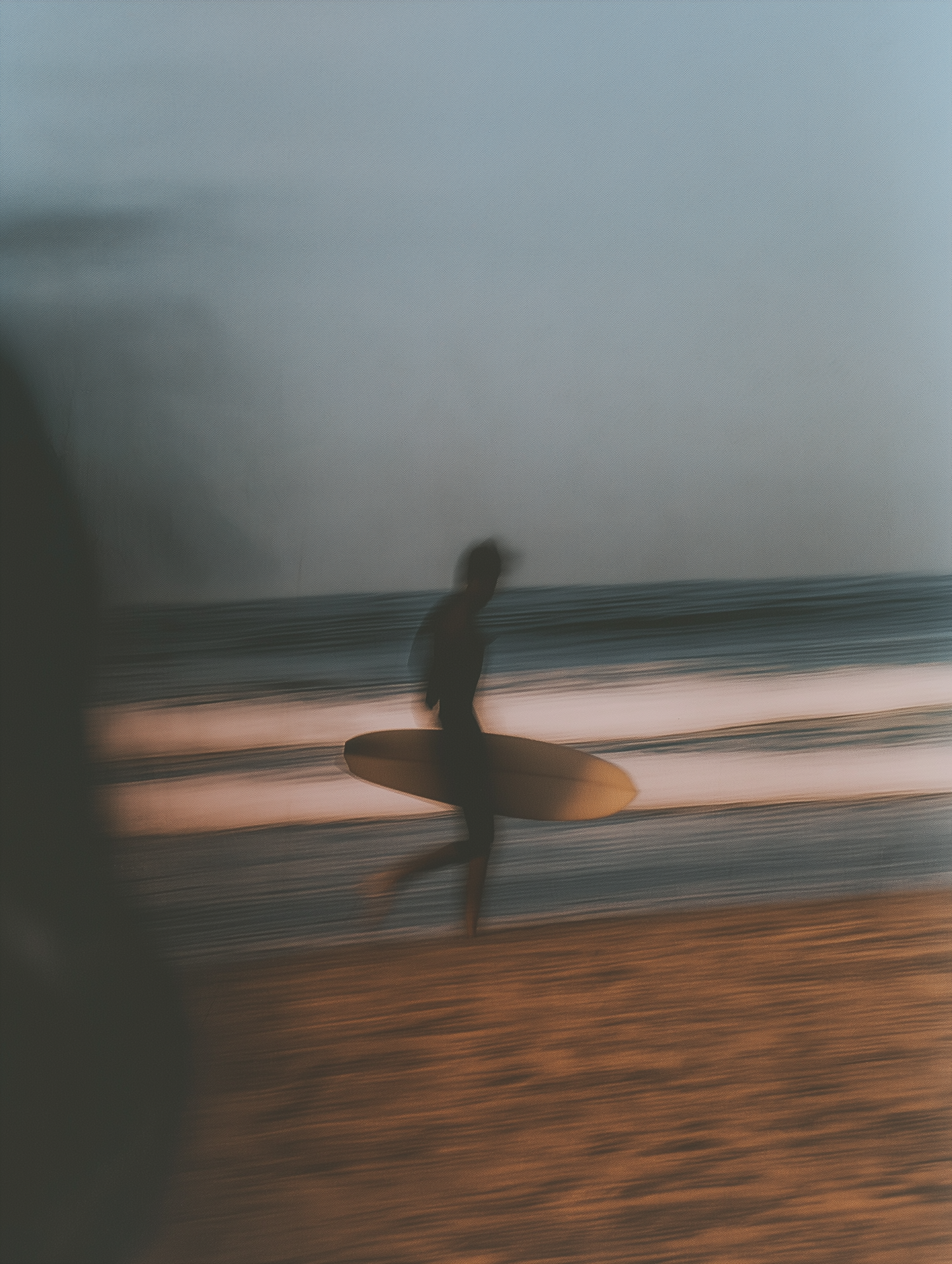 Silhouette of Surfer on Beach