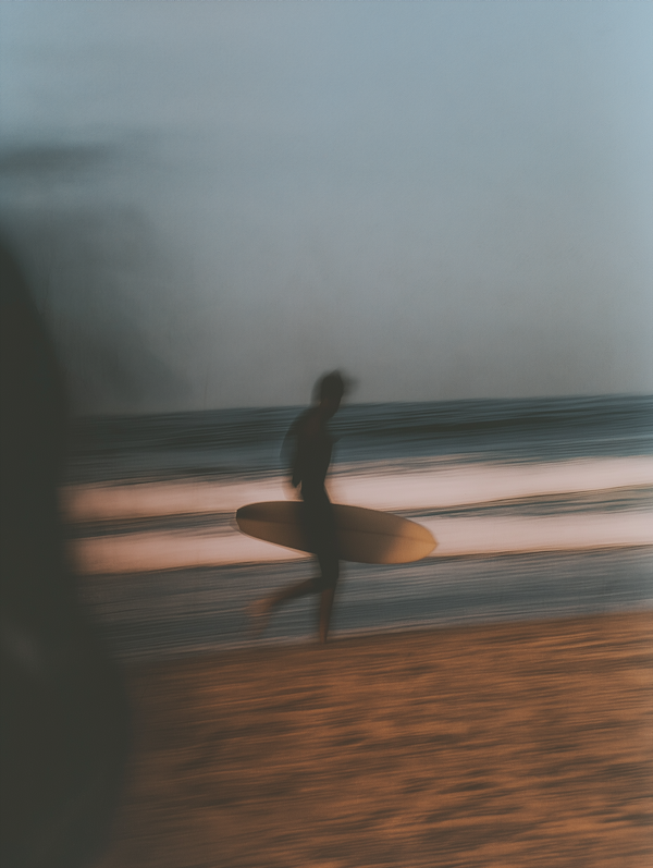 Silhouette of Surfer on Beach