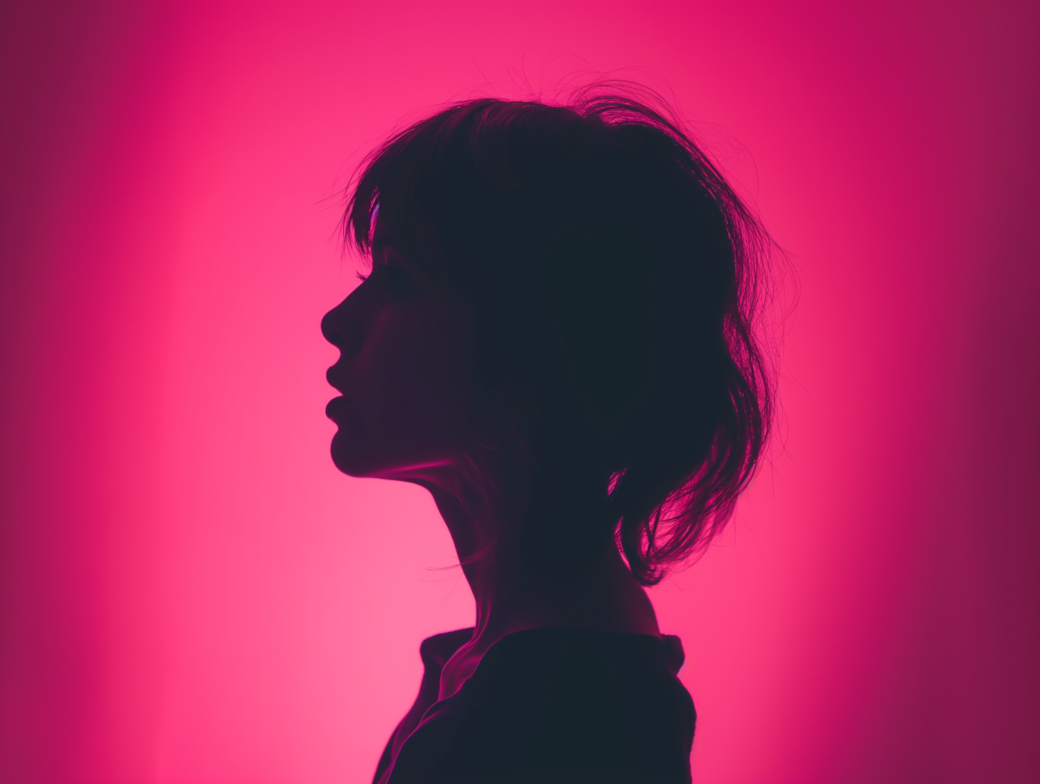 Enigmatic Silhouette against Vivid Pink