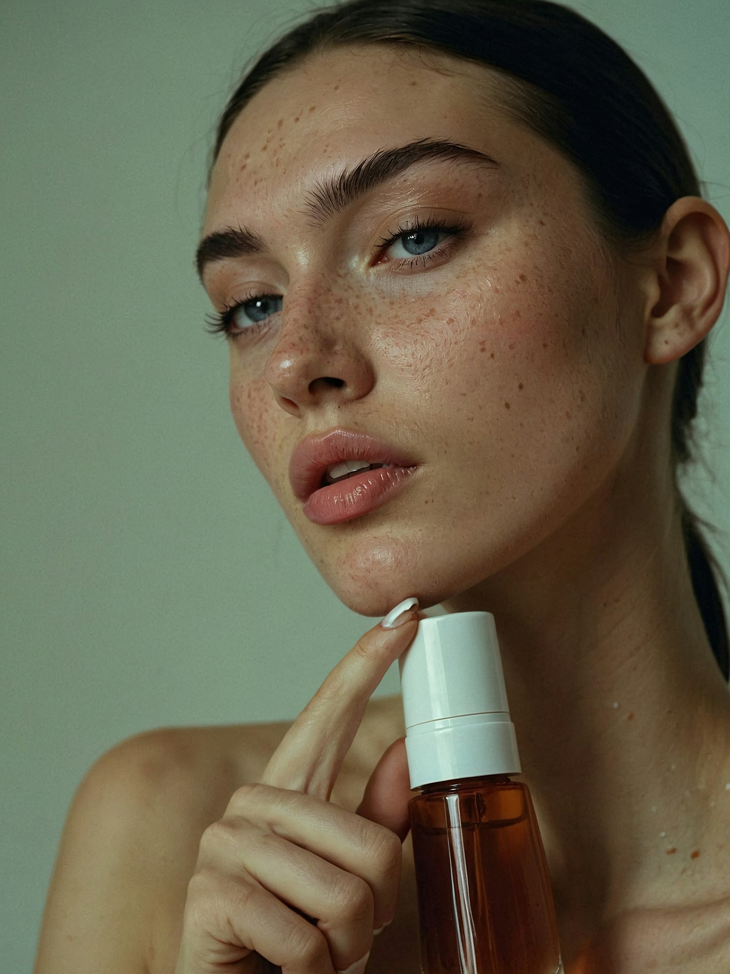 Close-up of Person with Skincare Product