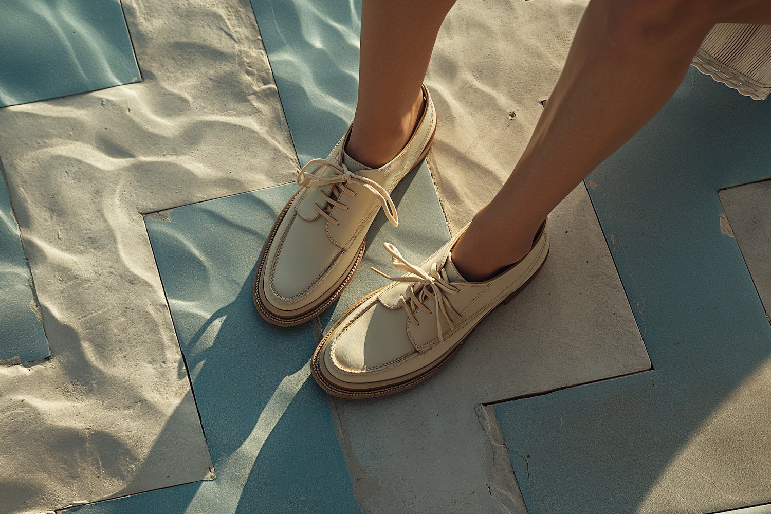 Casual Summer Elegance: Cream Shoes on Cool Blue Tiles