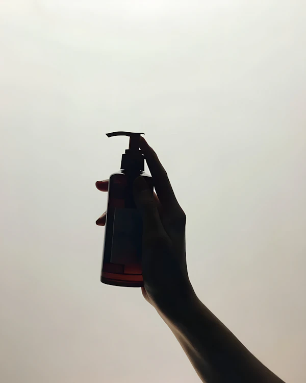 Hand Holding Pump Bottle
