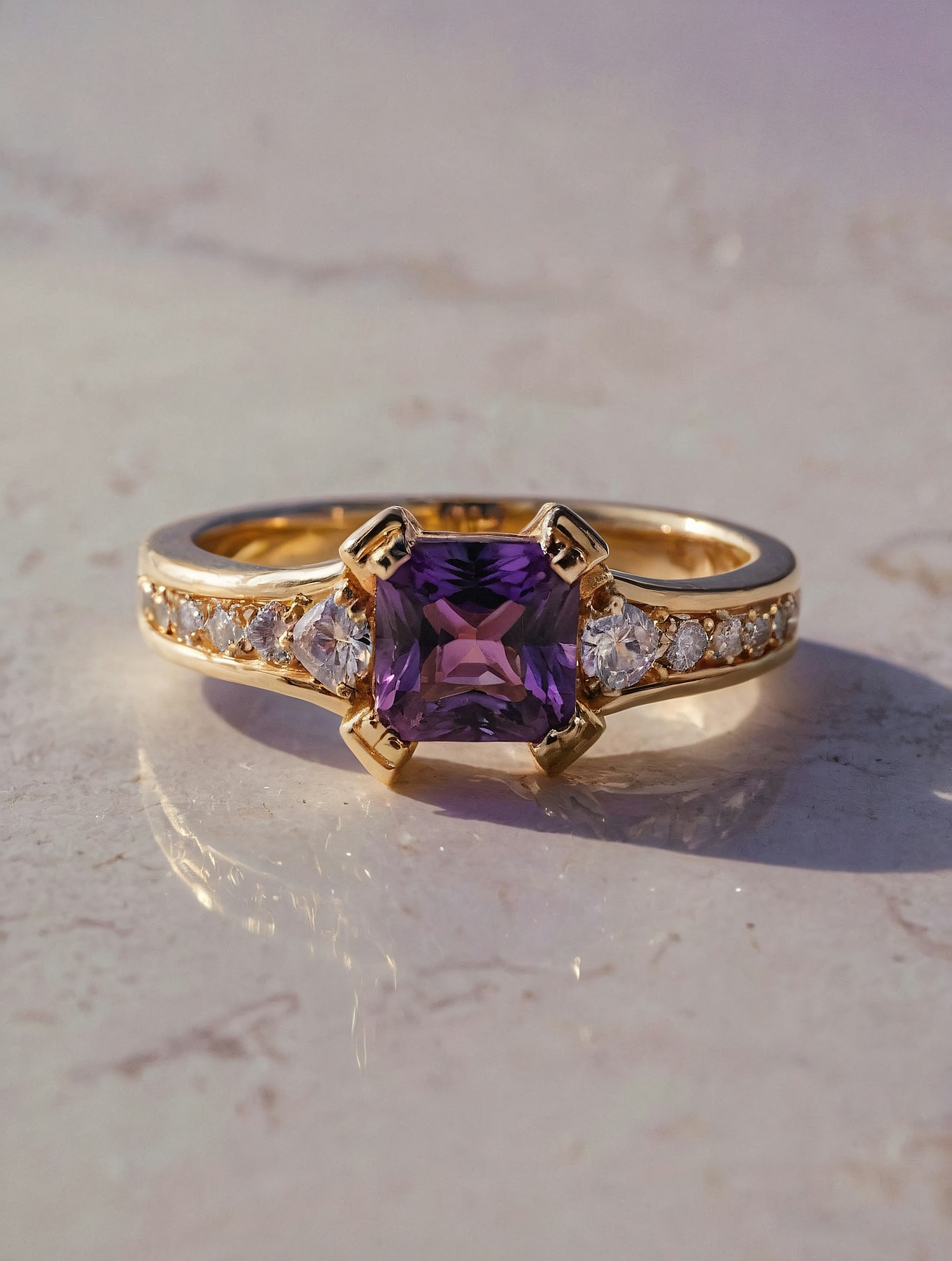 Elegant Gold Ring with Purple Gemstone