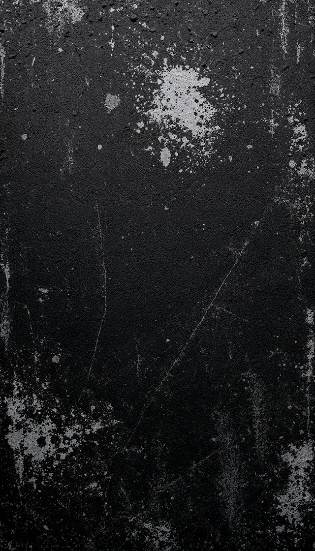 Textured Black Surface with Splatters