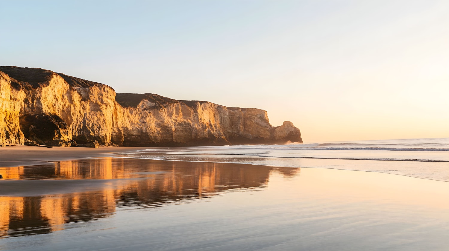 Serene Beach Sunset with Cliffs