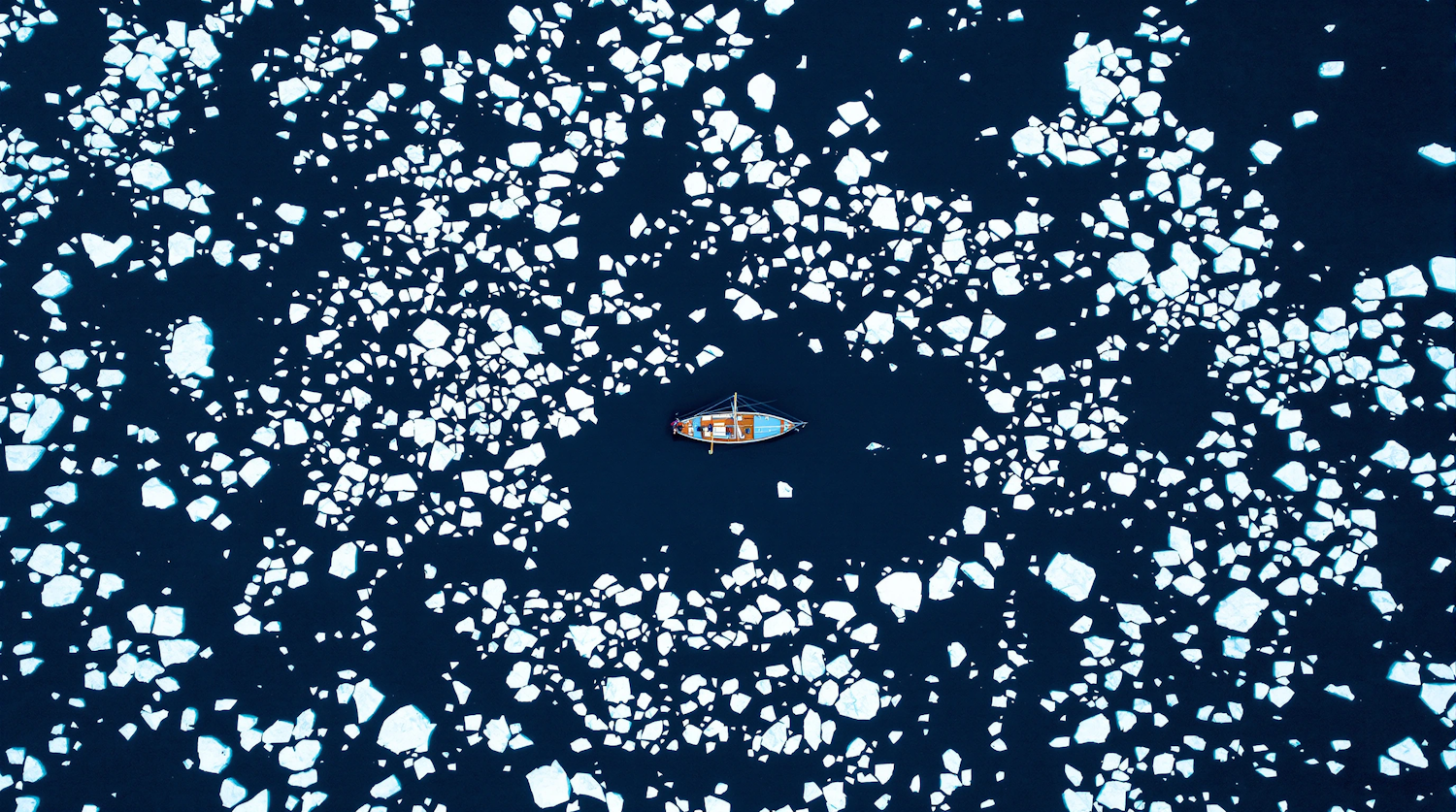 Aerial View of Boat in Icy Waters