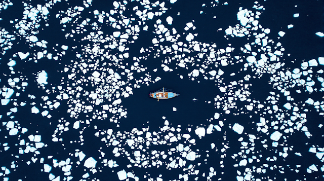 Aerial View of Boat in Icy Waters