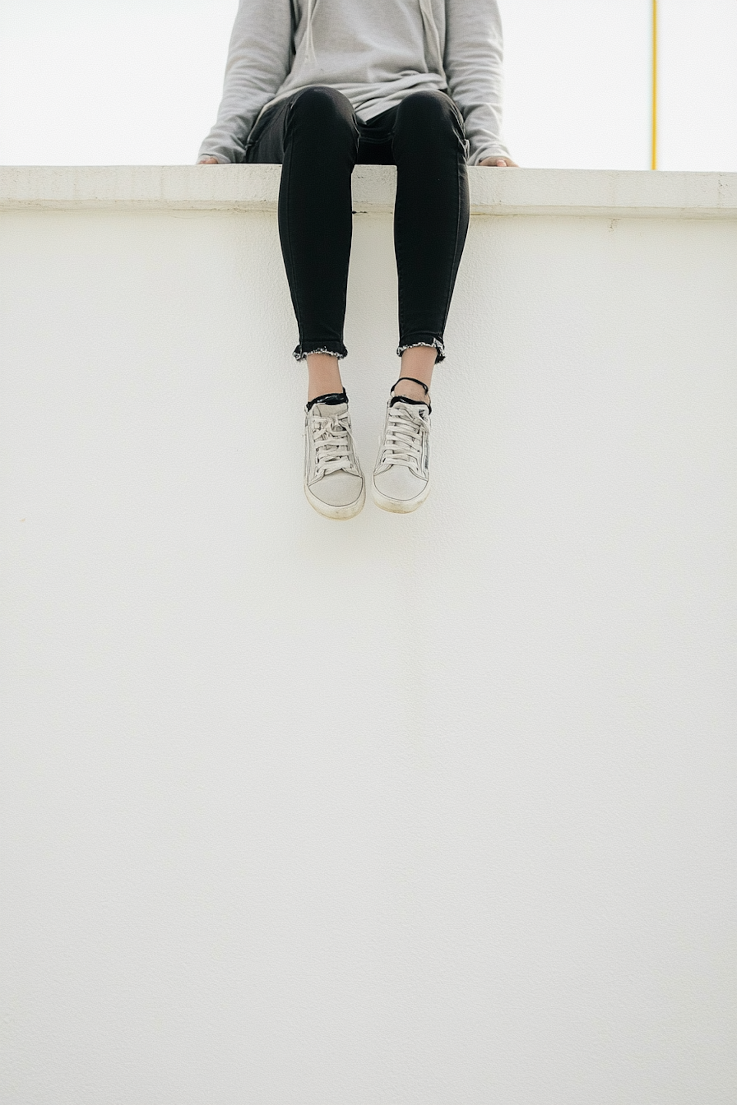 Contemplative Pose on Ledge