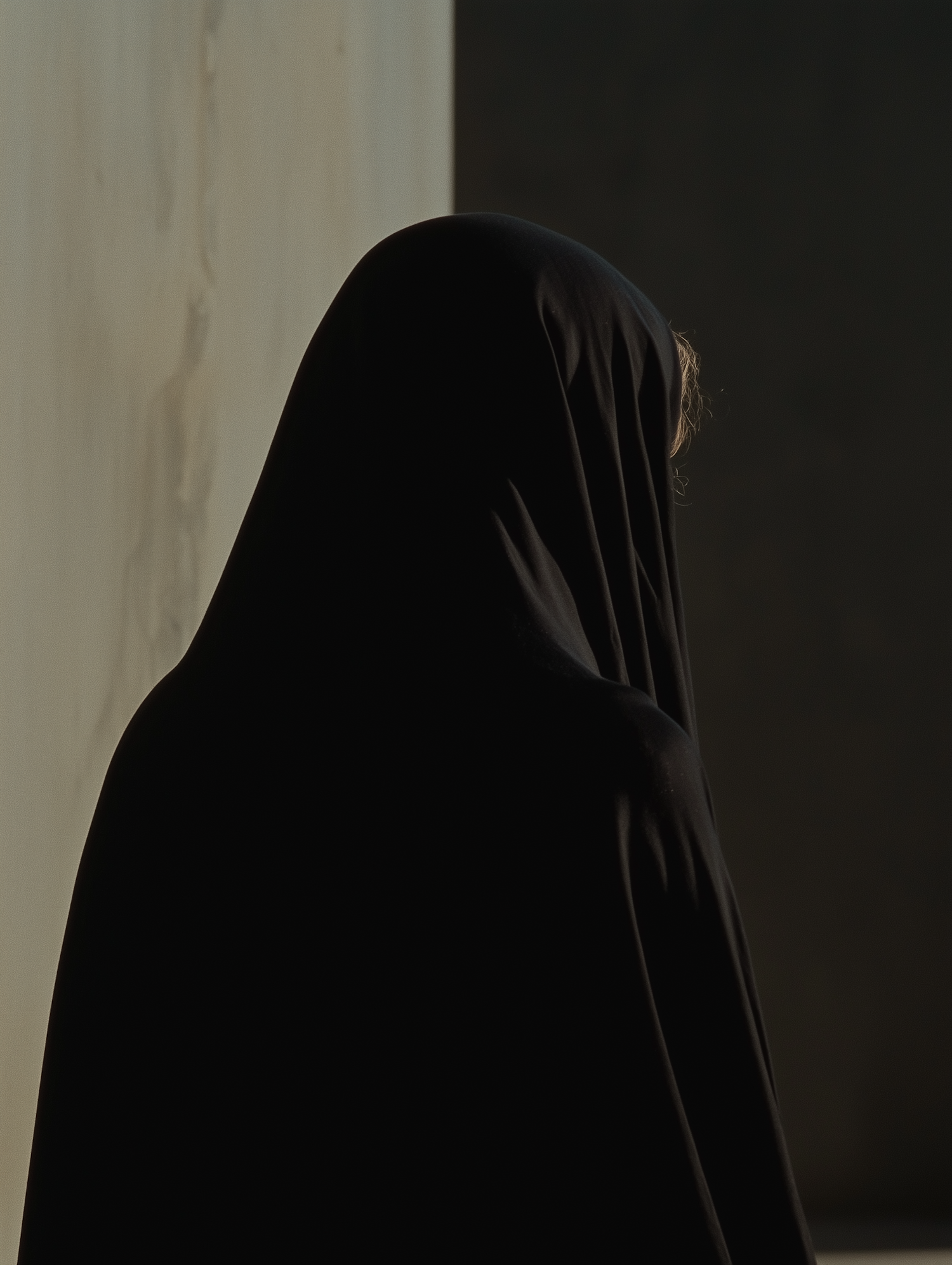 Silhouette in Black Cloak