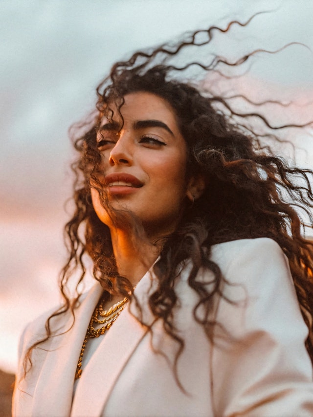 Woman with Flowing Hair in Golden Light