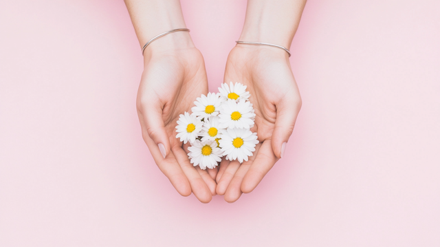 Hands Holding Daisies