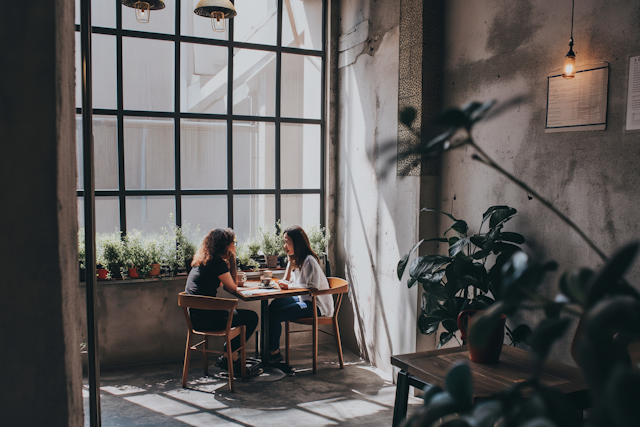 Sunlit Cafe Conversation