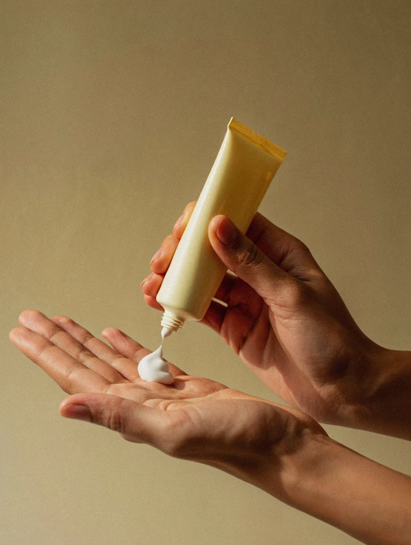 Hands with Cream Tube