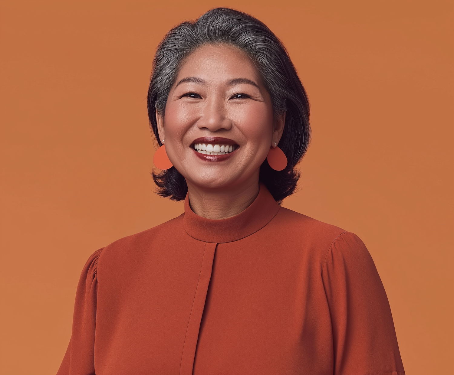 Smiling Woman in Orange Blouse