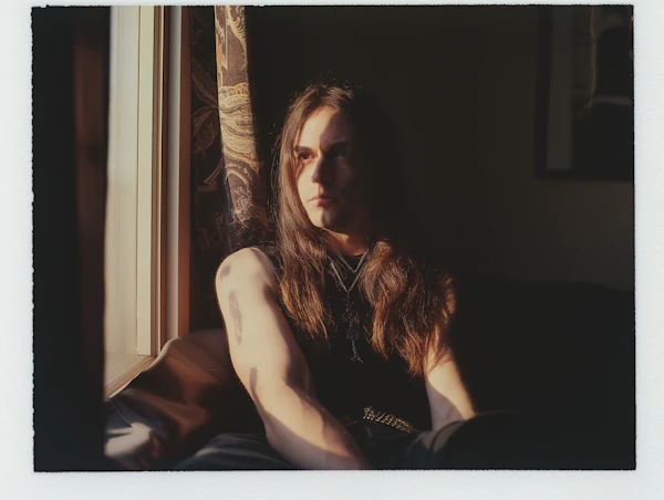 Contemplative Young Man by the Window
