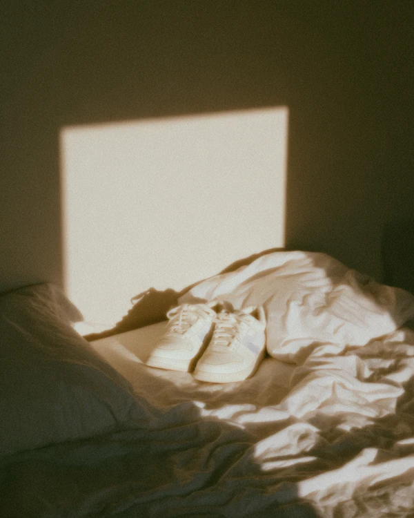 White Sneakers on Bed